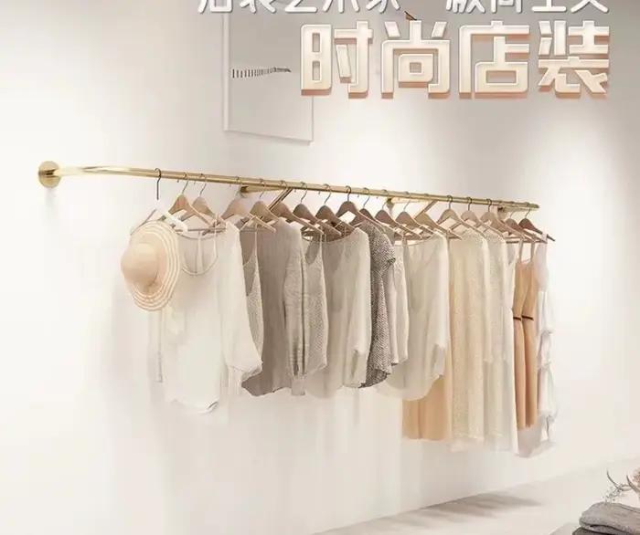 Présentoir de magasin de vêtements suspendu au mur