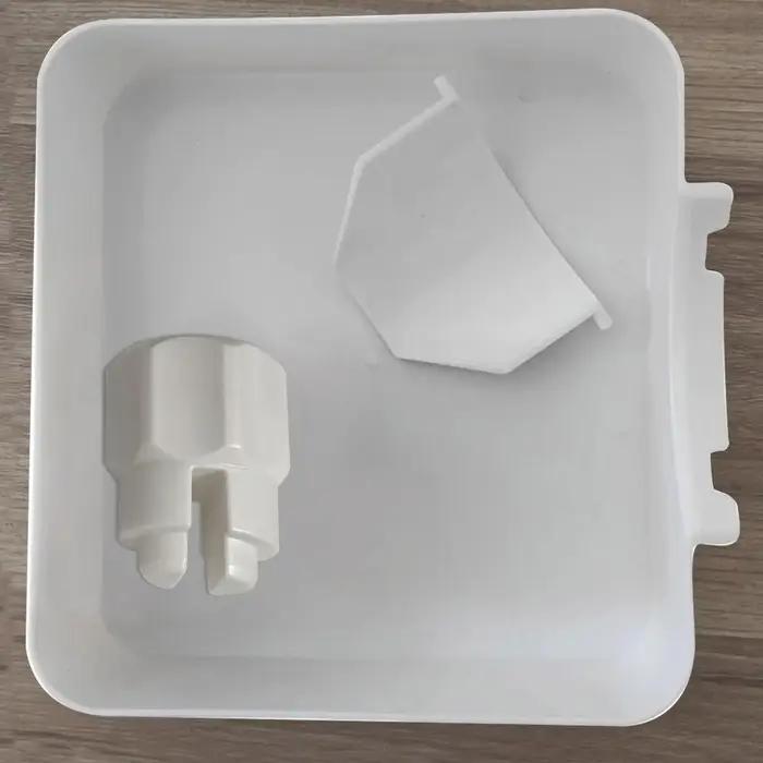 Entonnoir de vidange pour machine à laver, utilisé pour nettoyer le bac de récupération des résidus du filtre anti-peluches, empêchant les fuites d'eau dans la buanderie. 