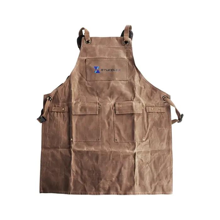 Tablier de protection en toile cireuse pour bijoutiers avec 4 poches pour outils et bretelles rembourrées marine pour sécurité et confort professionnel