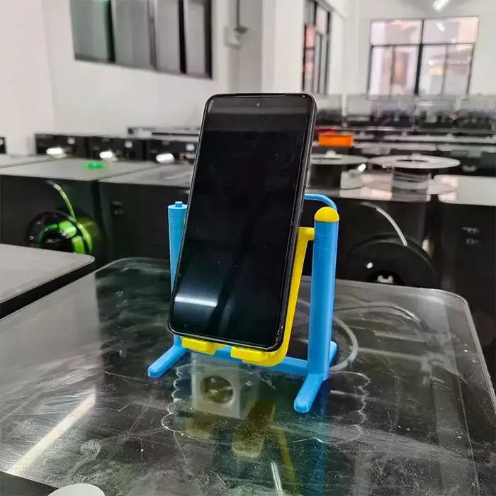 Support de téléphone créatif, équipement de fitness à assembler, support paresseux original pour la visualisation de vidéos verticales, ornement de bureau imprimé en 3D.