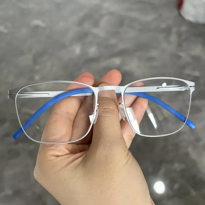 Monture de lunettes carrée sans vis en acier fin pour hommes style moderne design allemand occassions quotidiennes et formelles