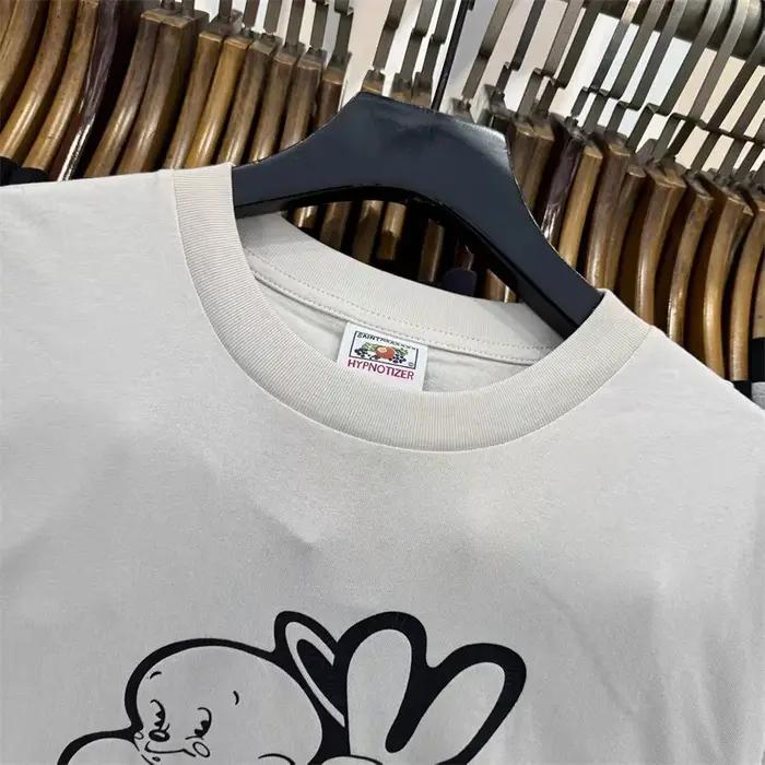 SAINT Mxxxxxx T-shirts à manches courtes avec imprimé petit ange pour hommes et femmes, t-shirts décontractés blancs