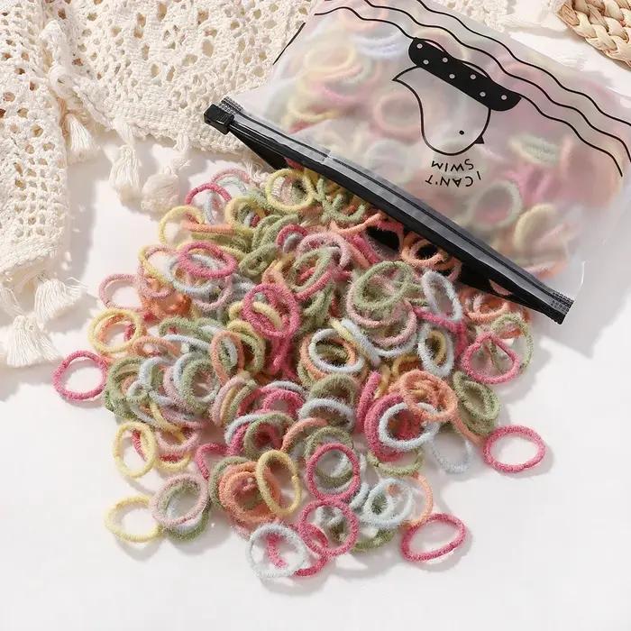 100 pièces/sac bandes de cheveux élastiques filles bébé accessoires