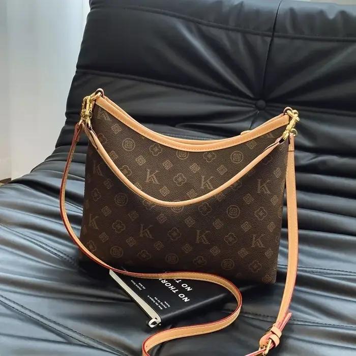 Sac à langer élégant et décontracté en fibre synthétique grand capacité pour femme polyvalent à porter en bandoulière occassions spéciales