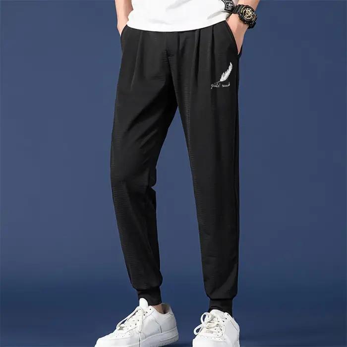 Pantalon été homme mesh soie glacée slim étudiant sport jeune chasse légère respiration rapide