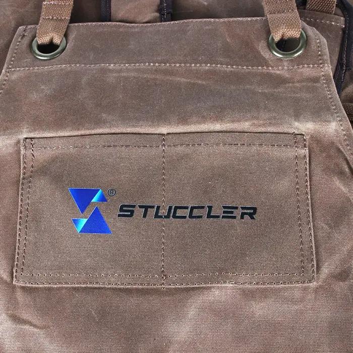 Tablier de protection en toile cireuse pour bijoutiers avec 4 poches pour outils et bretelles rembourrées marine pour sécurité et confort professionnel