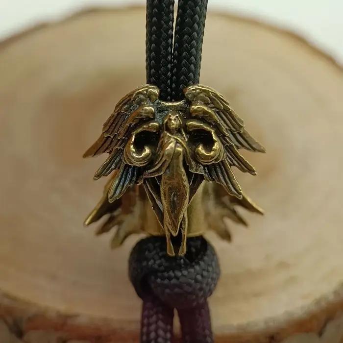 Perles de couteau en laiton Séraphin à six ailes