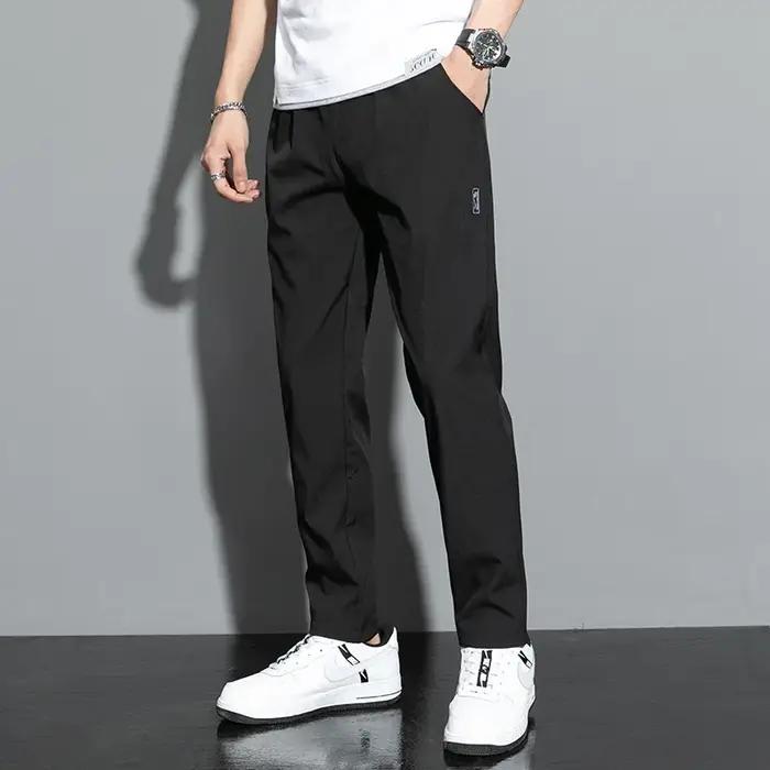 Pantalons pour hommes en soie glacée 2025 été nouveau noir gris mince