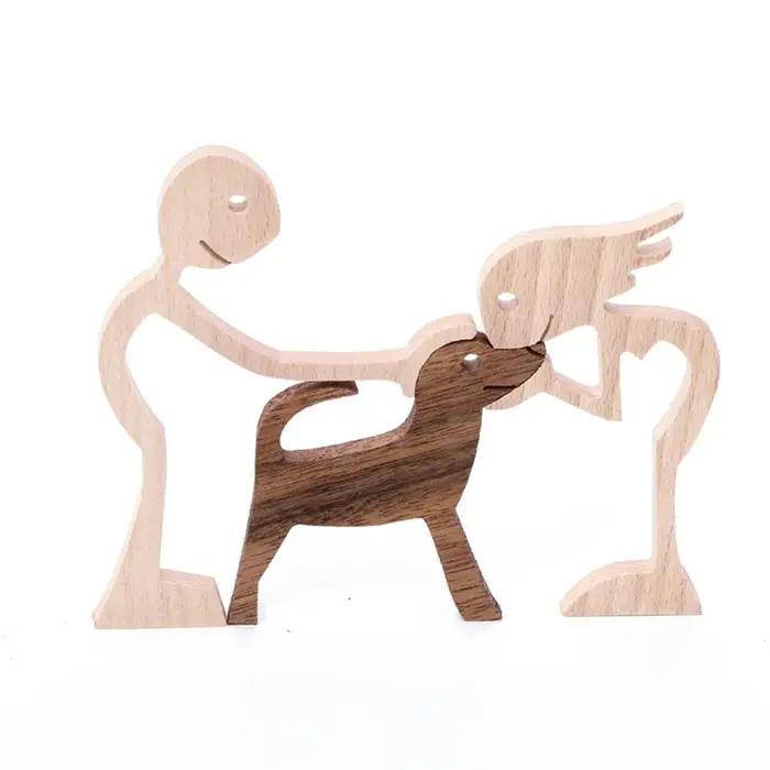 Figurine artisanale en bois de chien et d'humain
