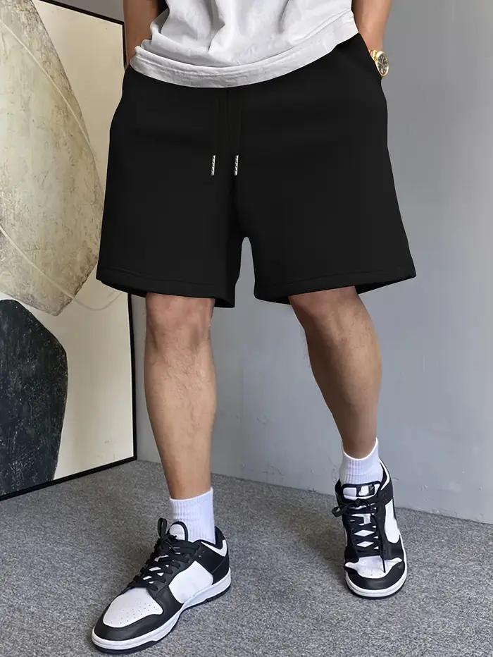 Shorts décontractés pour hommes en coton ample et élastique, avec impression de motifs, pour un style unique toute l'année
