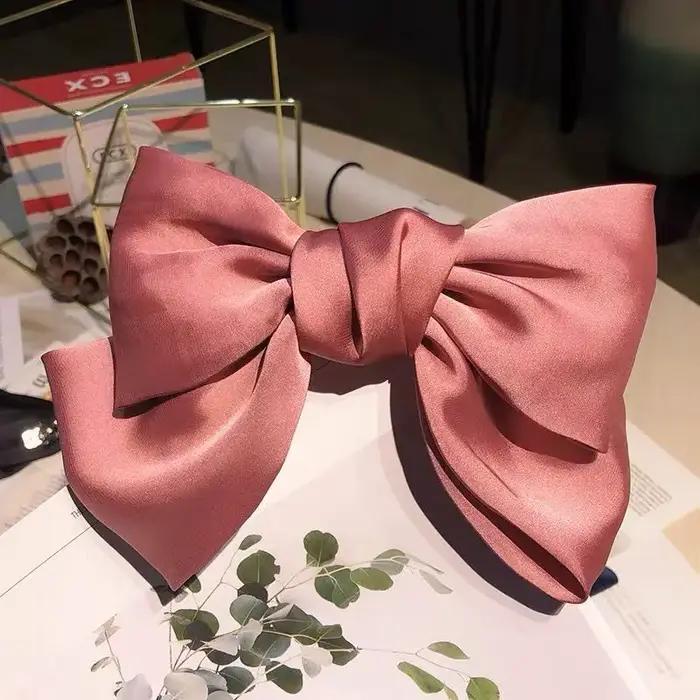 Barrette à cheveux en soie pour queue de cheval avec grand nœud papillon élégante pour femmes occasions spéciales et tenues quotidiennes