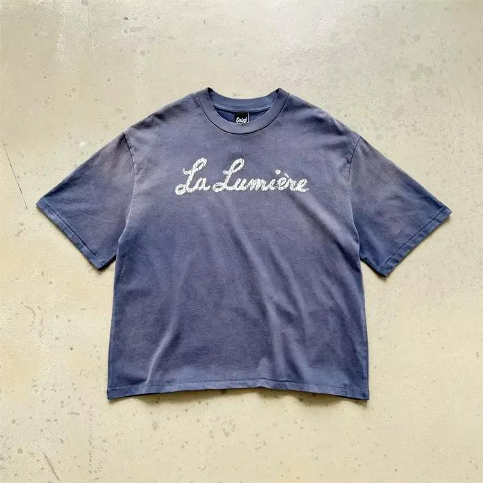 T-shirt Vintage Saint La Lumière Bleu Délavé Hommes Femmes Confortable Décontracté Pour Hommes Occasions Quotidiennes